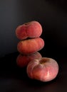 Four doughnut peaches on black background Royalty Free Stock Photo