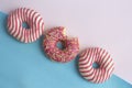 Doughnuts lies on pink and blue background Royalty Free Stock Photo