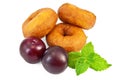 Doughnuts with mint and plums Royalty Free Stock Photo