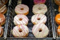 Doughnuts with White glaze on the grocery store window Royalty Free Stock Photo
