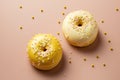 Doughnuts with yellow glaze and sprinkles