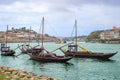 Douro river with rabelos boat and port wine barrels at Porto Oporto city Royalty Free Stock Photo