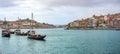 Douro river with rabelos boat and port wine barrels at Porto Oporto cityscape panorama Royalty Free Stock Photo