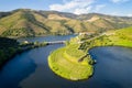 Douro wine valley region drone aerial view of s shape bend river in Quinta do Tedo at sunset, in Portugal