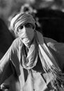 An unidentified young bedouin man wears traditional clothing
