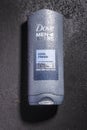Dove body and face wash isolated on stone slate background. Dove is personal care brand owned by Unilever originating in UK