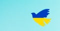 Dove in the colors of the ukrainian flag, symbol for peace and hope, pigeon bird in blue and yellow, war with russia Royalty Free Stock Photo