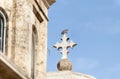 A dove sits on a stone cross on the roof of the Church of the Condemnation on the Via Dolorosa Street in the old city of