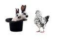 dove and two rabbit sits in a black hat on white background Royalty Free Stock Photo