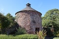The dovecote at Dunster in Somerset. Ancient monument with weather vane Royalty Free Stock Photo