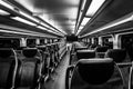 Dover, NJ USA - November 1, 2017: NJ Transit train at night with empty seats, black and white Royalty Free Stock Photo