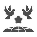 Doves and planet earth solid icon, International day of peace concept, Flying birds under world globe sign on white