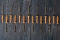 Dowels on wooden background