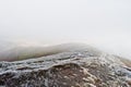 Down the mountain on frozen morning and fog. Royalty Free Stock Photo