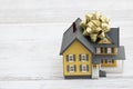 Down Payment Gift with a house with a bow on a desk Royalty Free Stock Photo
