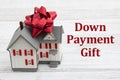 Down Payment Gift with a house with a bow on a desk Royalty Free Stock Photo