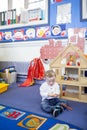 Down Syndrome Boy at Nursery Royalty Free Stock Photo