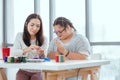 Down syndrome girl pursues a hobby of sculpting and painting Royalty Free Stock Photo