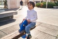 Down syndrome kid playing at park Royalty Free Stock Photo
