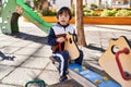 Down syndrome kid playing at park Royalty Free Stock Photo