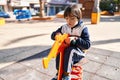 Down syndrome kid playing at park Royalty Free Stock Photo