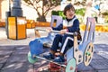 Down syndrome kid playing at park Royalty Free Stock Photo