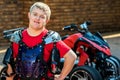 Down syndrome quad bike rider. Royalty Free Stock Photo