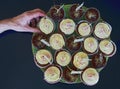 Down view of chocolate and vanilla cup cakes with a hand taking one Royalty Free Stock Photo