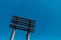 Down view of electric pole on background of blue sky. Royalty Free Stock Photo