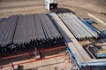 Down view through Rig floor stairs to pipes on pipe rack next to catwalk Royalty Free Stock Photo