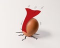 Downfallen superhero Easter egg with red cape Royalty Free Stock Photo