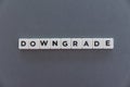 Downgrade word made of square letter word on grey background
