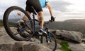 A downhill mountain biker drives down the rocks in Galicia. Royalty Free Stock Photo