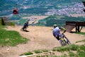 Downhill mountain bikers riding down the trail on Pohorje near Maribor, Slovenia Royalty Free Stock Photo