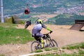 Downhill mountain bikers riding down the trail on Pohorje near Maribor, Slovenia Royalty Free Stock Photo