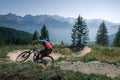 Downhill mountain biking on a shaped bike park trail in Austria