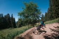 Downhill mountain biking on a shaped bike park trail in Bavaria, Germany