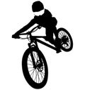 Downhill mountainbiker at the jump, mtb black silhouette. Royalty Free Stock Photo