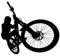 Downhill mountainbiker at the jump, mtb black silhouette. Royalty Free Stock Photo