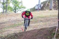 Downhill rider with bicycle. Fast speed and jump. Autumn 2018.