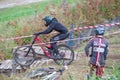 Downhill rider with bicycle. Fast speed and jump. Autumn 2018.