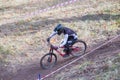 Downhill rider with bicycle. Fast speed and jump. Autumn 2018.