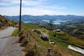 Downhill road sea bay Akaroa Royalty Free Stock Photo