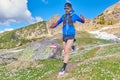 Downhill runner on reported mountain trail_2