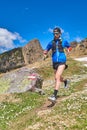 Downhill runner on reported mountain trail