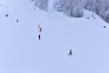 Downhill skier. Snowboarders and skier ride on snow in the mountains. Downhill ride. Adventure skiers season. Skiing and