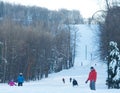 Downhill Skiers Skiing Down Wide Slope