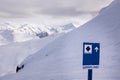 Downhill skiers on Whistler Mountain, expert only ski run sign, ski mountain, winter, ski hill. Royalty Free Stock Photo