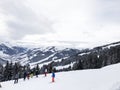 Downhill slope and apres ski and beautiful view of the Alps mountains Royalty Free Stock Photo