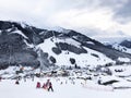 Downhill slope and apres ski and beautiful view of the Alps mountains Royalty Free Stock Photo